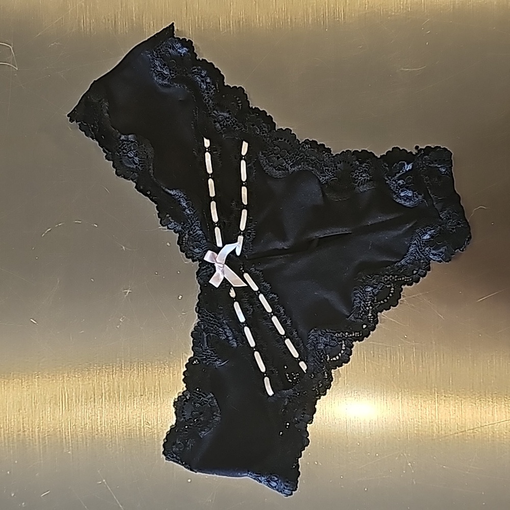 Victoria's Secret black panty with sexy backside cutouts and satin trim detail